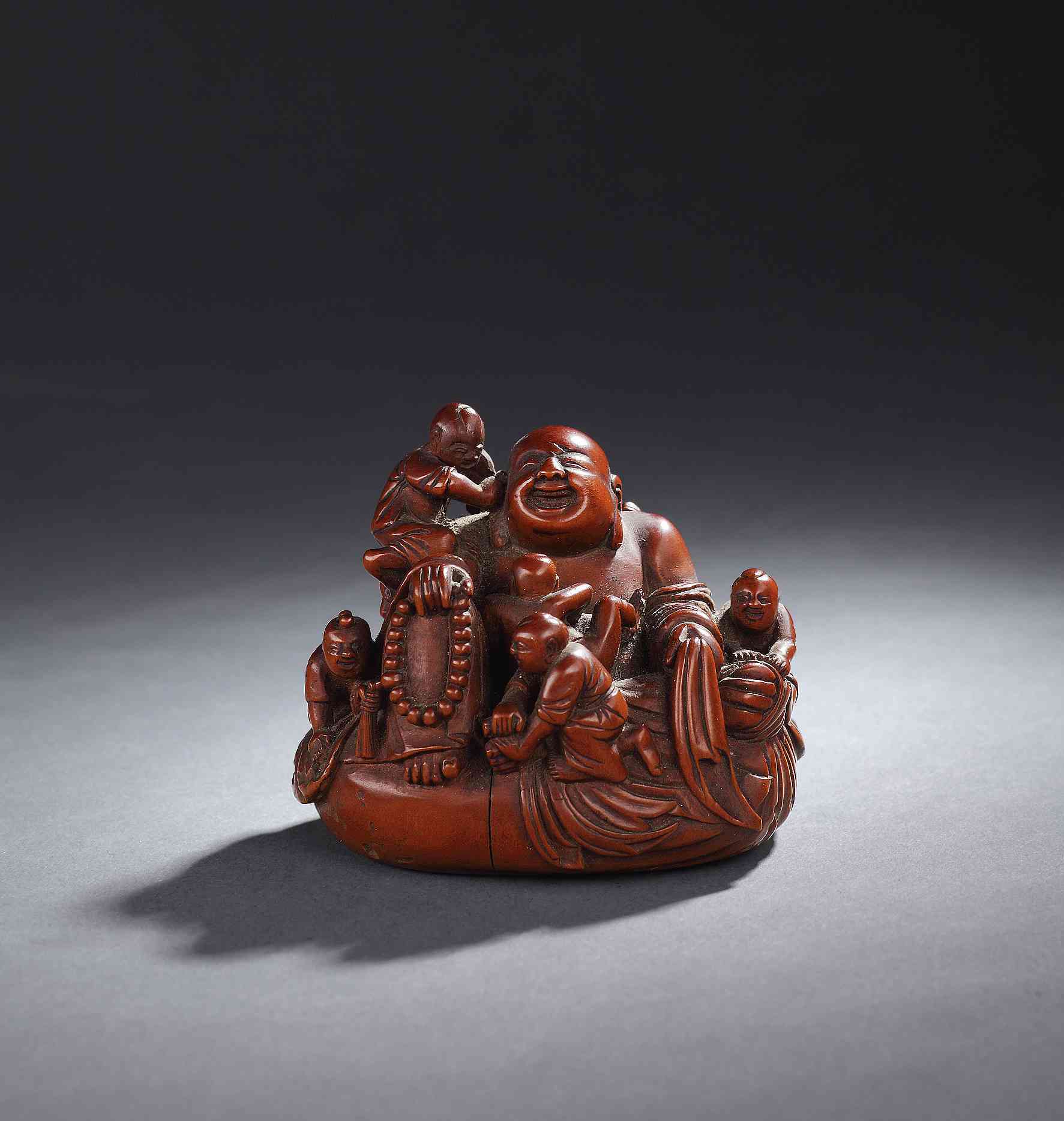 黄杨雕六子戏弥勒